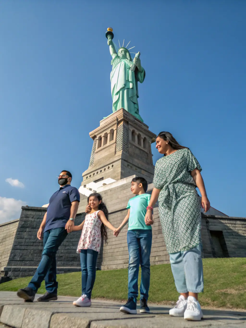 A heartwarming image of a family embracing in front of the U.S. Capitol building, representing the joy of family reunification through immigration.